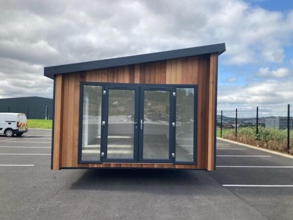 Exterior of the Serene Hideout Luxury Pod featuring a modern architectural silhouette, premium eco-friendly timber cladding, and a high-performance SIP structure.